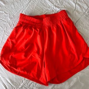 LULULEMON TRACK THAT HR SHORTS 5” in SOLAR ORANGE (SLRO)